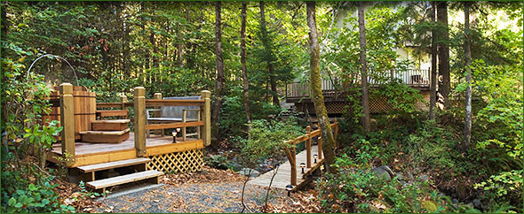 A beautiful view from the tub, with cottage in the background.